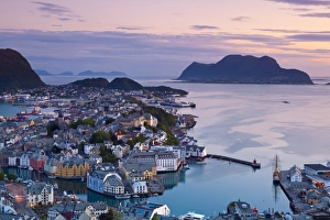 Alesund Prints: Elevated view over Alesund illuminated at dusk