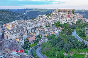 Ragusa Prints: Elevated view captures the landscape and buildings of Ragusa Ibla in Sicily during the evening hours