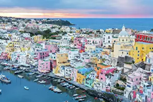 Naples Bay Prints: Elevated view of the colourful Italian fishing village of Marina Corricella at dusk