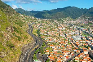 Highway Prints: Elevated view of Machico with mountains in background, Madeira, Portugal, Atlantic, Europe