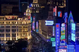 Bill Board Prints: Elevated view along Nanjing Donglu Road illuminated with neon signs at night