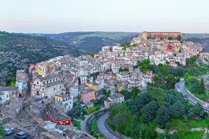 Neighborhoods Prints: Elevated view of Ragusa Ibla showing buildings and landscape in Sicily Italy under evening sky