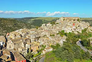 Ragusa Prints: Elevated view showing Ragusa Ibla in Sicily with its buildings and landscape under a clear sky