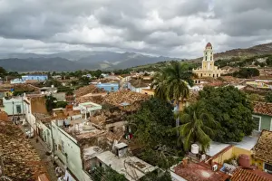 Trinidad Prints: An elevated view of the terracotta roofs and the bell tower of the Museo Nacional de la Lucha