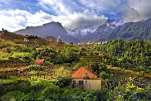 Sao Vicente Prints: Elevated view of village and tree covered hills and mountains at Lameiros
