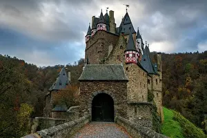 Photogenic Prints: Eltz medieval historic castle in an autumn landscape with trees at sunrise