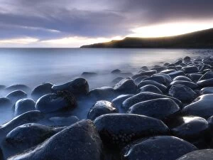 Embleton Bay Collection: Embleton Bay at dawn from beach of basalt boulders known as The Rumble Churn