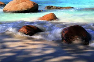 Azure Prints: Enjoy warm waves and rocks at Anse Lazio beach in Seychelles during a sunny day in tropical paradise