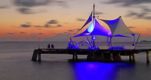 Silhouettes Prints: Enjoying the sunset on the pier near a hotel in Praslin