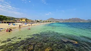 Swimming Prints: Enjoying the turquoise waters on the beach of Port de Pollenca in Mallorca Spain during a sunny day