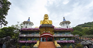 Entrance to Dambulla Museum with caves beyond, Dambulla, Sri Lanka, Asia