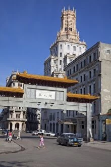 Entrance gate to Chinatown with ornate apartment building, Havana, Cuba