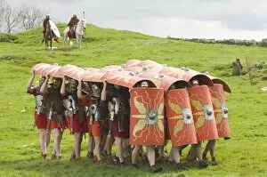 Northumbria Collection: Ermine Street Guard advancing with protective shields, cavalry in attendance