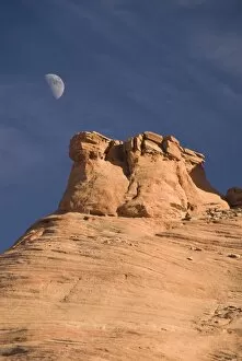 Images Dated 26th October 2009: Eroded rock formations with moon in the sky, Mystery Valley, Monument Valley Navajo Tribal Park