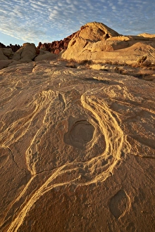 State Park Prints: Erosion pattern in yellow sandstone under patterned clouds