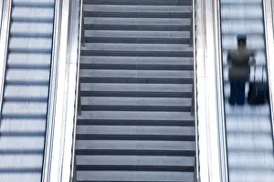 Escalator and stairs leading to the platform at modern train station, Berlin