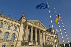 Parliament Building Prints: The EU and German national flags flying outside the famous Reichstag parliament building
