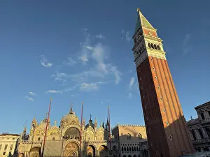 Sights Prints: Evening light illuminates Campanile and Basilica at St Marks Square in Venice Italy