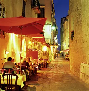 Restaurant Prints: Evening restaurant scene in Haute Ville, Bonifacio, South Corsica, Corsica, France, Europe