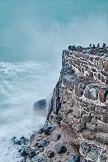 Strength Prints: Evening shoreline, Atlantic surf crashing against the harbour wall at Hartland Quay