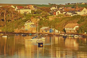 Anchor Prints: Evening sunlight over the River Avon estuary with views of Bantham village in Devon