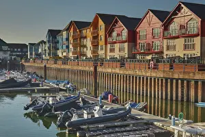 Estate Prints: Evening sunlight shines on apartment buildings by the harbor in Exmouth