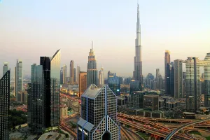 Bright Prints: Evening view of central Dubai skyline with Burj Khalifa shining brightly at night in the United Arab Emirates