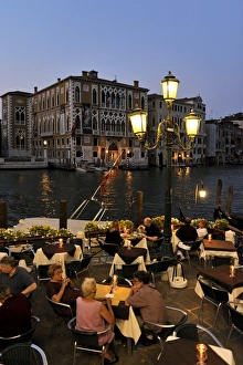 Grand Canal Prints: Evening view of a restaurant beside the Grand Canal, Venice UNESCO World Heritage Site