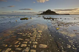 Marazion Prints: An evening view of St. Michaels Mount, one of Cornwalls most iconic landmarks