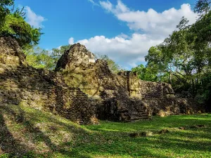 Landscaping Prints: Exploration of ancient ruins at Uaxactun Archaeological Site in Guatemala during midday