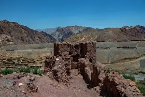 Range Prints: Exploration of Shahr-e Zuhak with its ancient structures and rugged mountains in the background near Bamyian