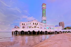 Penang Prints: Explore the beauty of Penang Floating Mosque at sunset along the shore in Malaysia