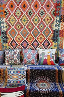 Stalls Prints: Explore carpets and pillows for sale in Kaleici market in Antalya Province