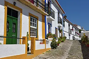 Alentejo Prints: Explore charming alleys with white houses and colorful details in Mertola