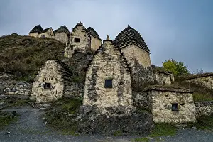 Cemetery Prints: Explore historic burial structures in Dargavs surrounded by mountains in North Ossetia