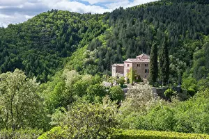 Gard Prints: Explore the historic Castle of Mandagout surrounded by lush greenery in the Cevennes Mountains in France