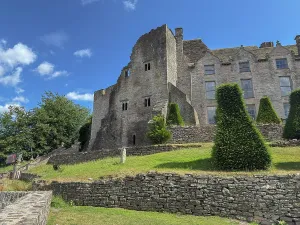 Weekend Prints: Explore the historic structure and grounds of a castle in Hay on Wye with clear blue skies above in Powys