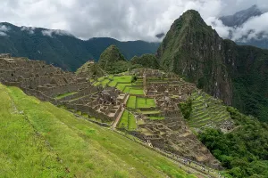 Terraces Prints: Explore the Inca ruins of Machu Picchu on a cloudy day in Peru with stunning mountain views