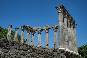 Columns Prints: Explore the remains of Roman Temple of Evora in Portugal with ancient columns and blue sky