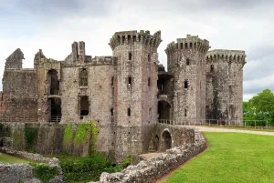 Landscaping Prints: Explore the ruins of Raglan Castle with its towers and stone walls in a green landscape in Monmouthshire