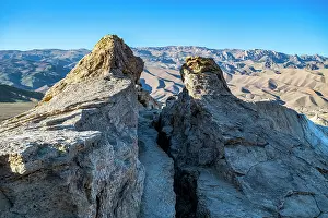 Climbing Prints: Explore the Valley of the Dragon with its rocky formations and vast sandy landscapes in Afghanistan