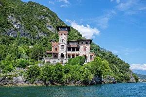 Luxury Prints: Explore Villa Gaeta by the shores of Lake Como in Italy on a sunny day surrounded by lush greenery and mountains