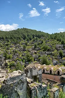 Recreational Prints: Exploring an abandoned Greek town with old houses and a church set against lush mountains in Fethiye