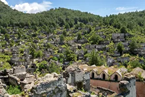 Escape Prints: Exploring the abandoned houses and church of Kayakoy ghost town in Fethiye Turkey surrounded by mountains