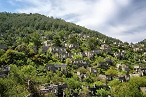 West Prints: Exploring the abandoned houses of Kayakoy ghost town surrounded by mountains and vegetation in Turkey