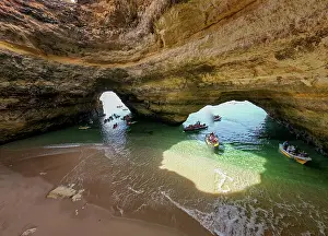 Attractions Prints: Exploring Algar de Benagil cave with boats and visitors in the clear water of Algarve