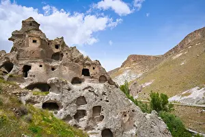 Cappadocia Prints: Exploring ancient rock houses with multiple floors in Cappadocia, Turkey during daylight