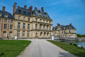 Landscaping Prints: Exploring the architecture and gardens of Fontainebleau palace in France on a clear day
