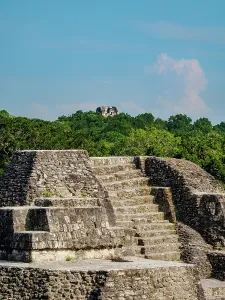 Cultures Prints: Exploring the architecture of the North Acropolis at Yaxha Archaeological Site in Guatemala under clear skies