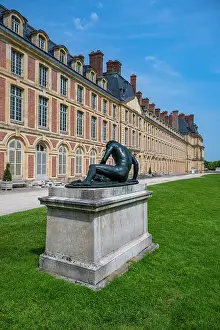 Enjoyment Prints: Exploring the art and architecture at Fontainebleau palace in France with a sculpture in the foreground